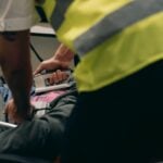 What Happens If You Canโt Return to Work After an Injury? 9 Paramedics provide urgent care to a patient on a stretcher during an emergency situation