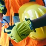 Close-up of personal protective equipment including gloves and helmet, essential for safety