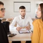 Juvenile Diversion Programs and Their Potential Effects on Future Employment 9 Employees talking around a table
