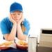 What Types of Sexual Harassment Can You Face at Work? 4 Unhappy teenage girl has a boring job serving fast food. Isolated on white.