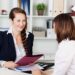 Guessing Game 2 Businesswoman conducting a job interview with a new hire