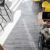 woman-in-wheelchair-browsing-laptop-in-cafe