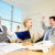 Why Teamwork is Essential for Success and How to Foster it in Your Team 2 Successful people raising up hands in the office