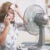How Florida Outdoor Workers Should Document Heat Illness 3 Woman suffers from heat in the office or at home