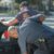 man-in-gray-t-shirt-being-searched-by-two-police-officers