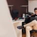 Guessing Game 7 man-smiling-while-sitting-and-using-macbook