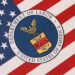 Guessing Game 2 US Department of Labor seal on United States of America flag close up