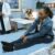 When a Workplace Injury Leads to a Workers’ Comp Claim: Steps Employees Must Take 7 Woman in Blue Denim Jacket and Black Denim Jeans Sitting on Hospital Bed