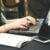 Woman Typing on Laptop