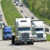 Sloping Highway With Trucks Traveling