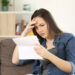 Guessing Game 3 Concerned woman reading bad news in a letter