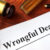 Common Challenges in Wrongful Death Claims and How to Overcome Them 7 Document with title Wrongful Death o a wooden surface