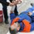 What Edison Residents Should Know About Filing Injury Claims 9 Injured Man lying on the Ground receiving a First Aid Treatment