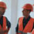Preventive Facility Maintenance as a Risk Management Strategy for Employers 4 Builders in safety helmets talking on construction site
