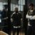 How the Labor Shortage Affects the Auto Industry 3 A police officer stands by two prisoners in jail