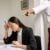 Why Expert Witness Consulting Firms Matter in Modern Litigation 8 An office scenario depicting a young woman experiencing bullying from a coworker