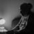 Why Expert Witness Consulting Firms Matter in Modern Litigation 6 A contemplative senior woman sits by a lamp in a dimly lit room, evoking deep thought and solitude