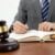 Who Can Be Held Liable in a Florida Medical Malpractice Case? 8 Attorney looking at a book with a gavel in the foreground